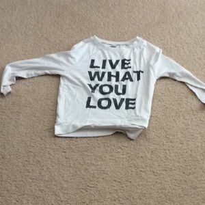 White long sleeve shirt with a word printed